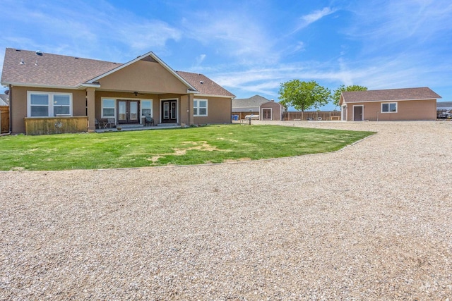 120 S Marko Ln, Kuna, ID 83634 - back of property with french doors, a patio area, and a ceiling fan
