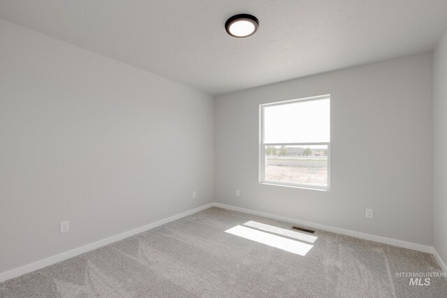 12596 Kinsella St, Nampa, ID 83651 - unfurnished room with baseboards, carpet flooring, and visible vents
