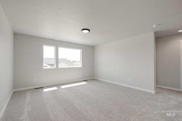 12596 Kinsella St, Nampa, ID 83651 - unfurnished room featuring light carpet and baseboards
