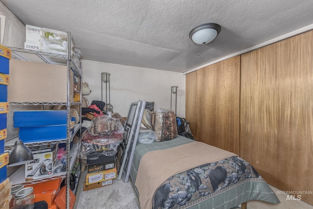 carpeted bedroom with a textured ceiling