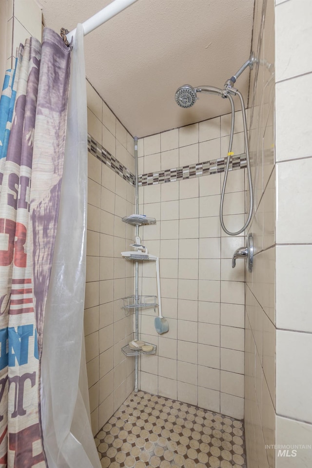 bathroom featuring a shower stall