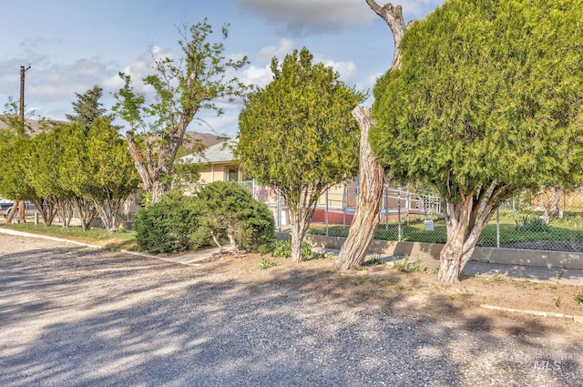 view of property exterior featuring fence