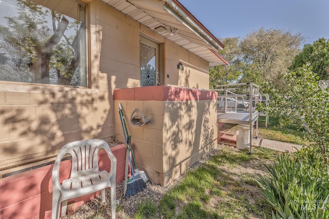 view of side of property with concrete block siding