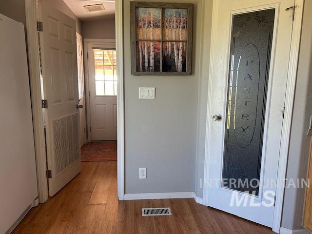 16 E 300 S Unit 16E 300S, Fairfield, ID 83327 - hall featuring wood finished floors and baseboards