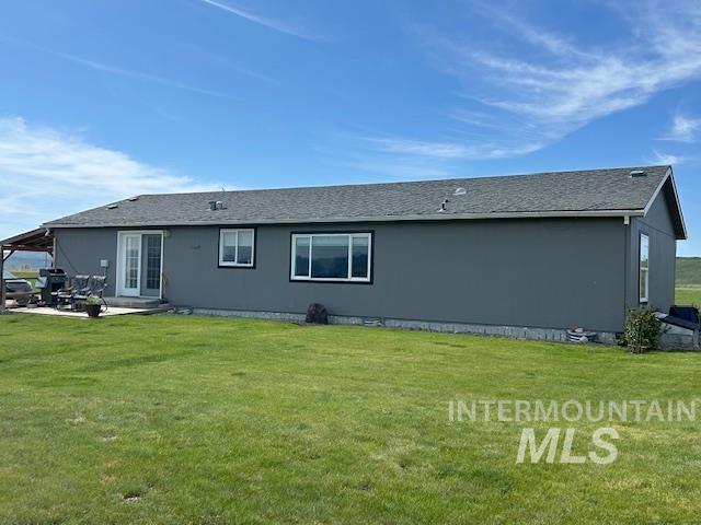 16 E 300 S Unit 16E 300S, Fairfield, ID 83327 - back of house featuring a yard and a patio