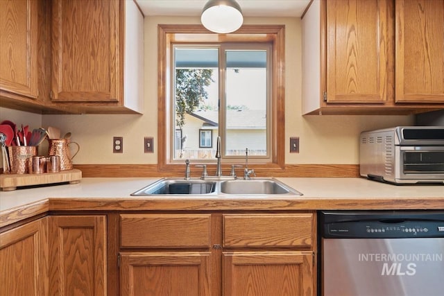 1460 Fairway Ct, Mountain Home, ID 83647 - kitchen with stainless steel dishwasher and light countertops