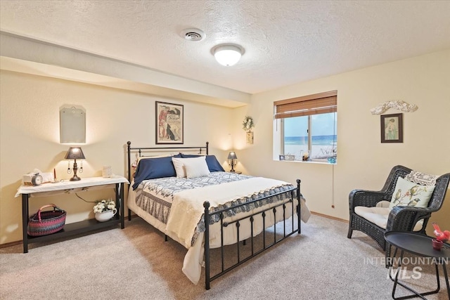 1460 Fairway Ct, Mountain Home, ID 83647 - carpeted bedroom with a textured ceiling and baseboards