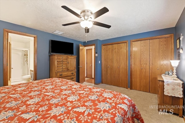 1460 Fairway Ct, Mountain Home, ID 83647 - bedroom featuring carpet, two closets, a textured ceiling, and ceiling fan