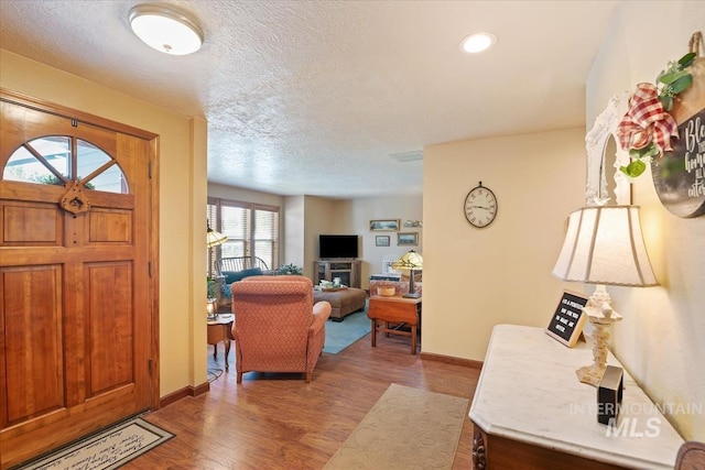 1460 Fairway Ct, Mountain Home, ID 83647 - foyer with wood finished floors and a textured ceiling