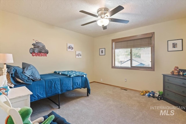1460 Fairway Ct, Mountain Home, ID 83647 - bedroom with carpet flooring, a textured ceiling, and ceiling fan