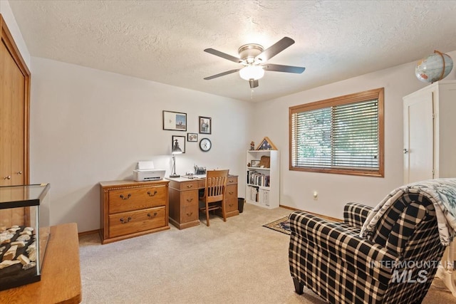 1460 Fairway Ct, Mountain Home, ID 83647 - home office with a ceiling fan, a textured ceiling, and light carpet