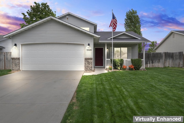 5509 Aspenwood Ave, Caldwell, ID 83607 - view of front of house with an attached garage, concrete driveway, brick siding, and covered porch