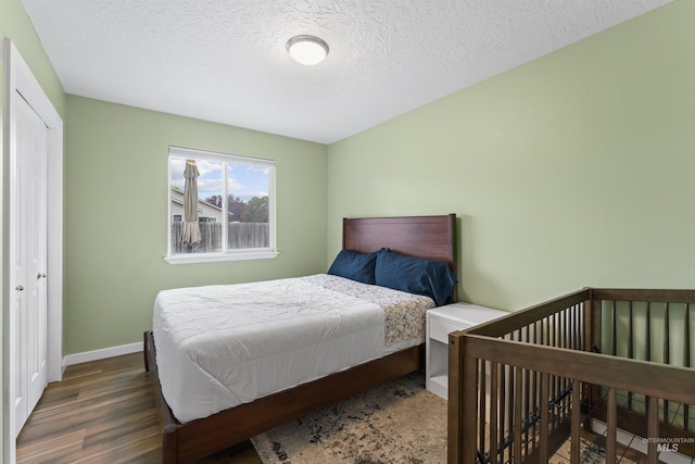 5509 Aspenwood Ave, Caldwell, ID 83607 - bedroom with wood finished floors and a textured ceiling
