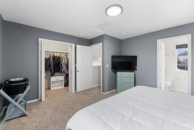5509 Aspenwood Ave, Caldwell, ID 83607 - carpeted bedroom with attic access, a walk in closet, a closet, and ensuite bathroom