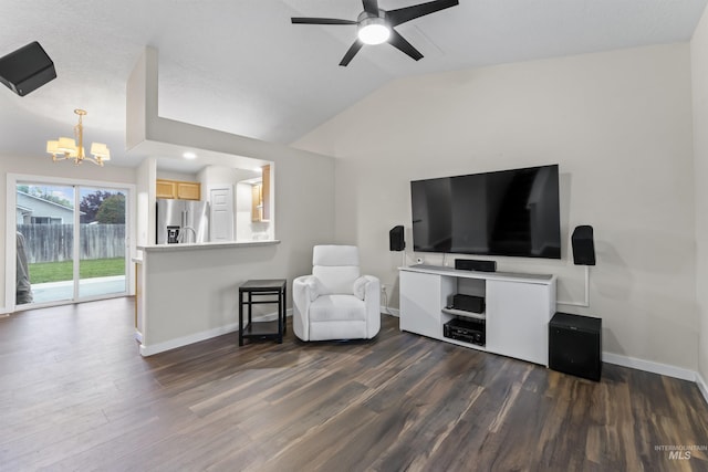 5509 Aspenwood Ave, Caldwell, ID 83607 - living area with a chandelier, vaulted ceiling, dark wood finished floors, a ceiling fan, and recessed lighting
