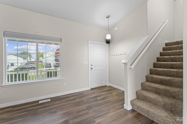 5509 Aspenwood Ave, Caldwell, ID 83607 - foyer entrance with dark wood-style floors and stairs