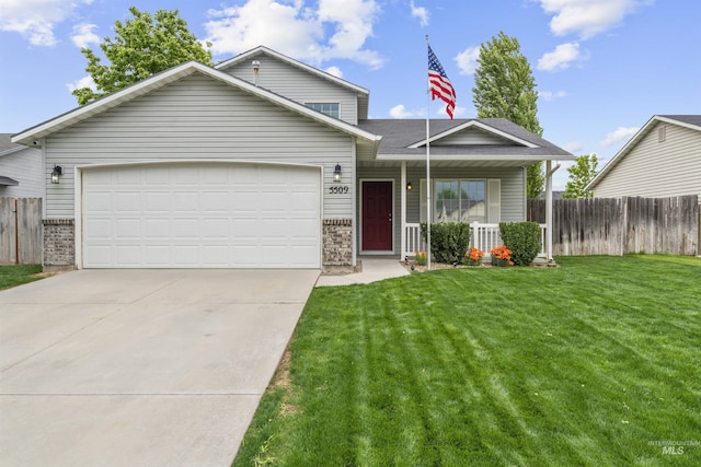 5509 Aspenwood Ave, Caldwell, ID 83607 - view of front of house featuring brick siding, concrete driveway, an attached garage, and covered porch