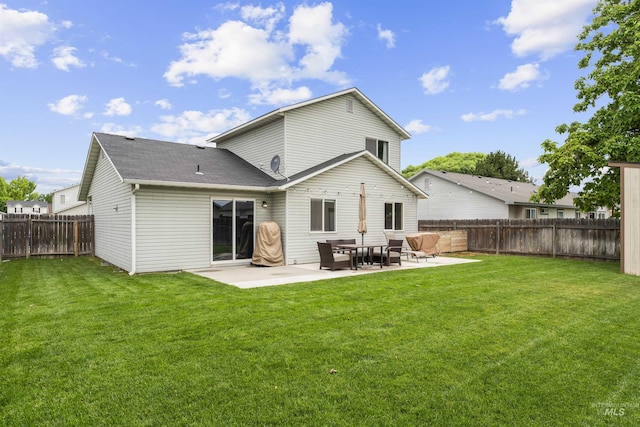5509 Aspenwood Ave, Caldwell, ID 83607 - back of property with a patio, a fenced backyard, and a shingled roof