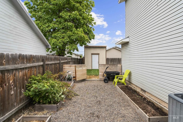 5509 Aspenwood Ave, Caldwell, ID 83607 - view of yard featuring a vegetable garden and a storage shed