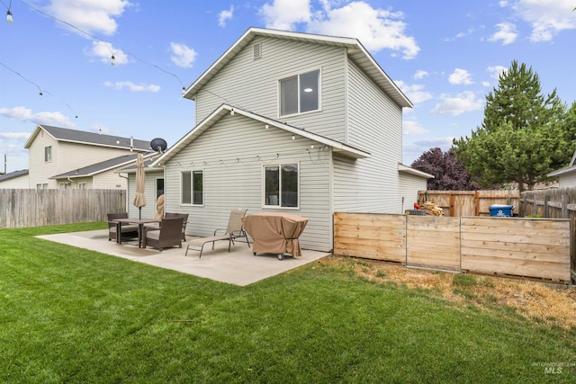 5509 Aspenwood Ave, Caldwell, ID 83607 - back of property with a fenced backyard and a patio
