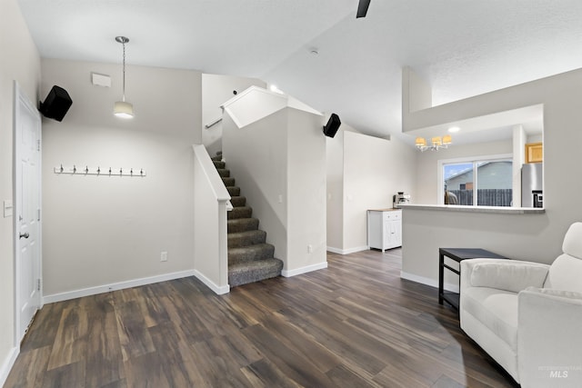 5509 Aspenwood Ave, Caldwell, ID 83607 - sitting room with stairway, vaulted ceiling, and dark wood-type flooring