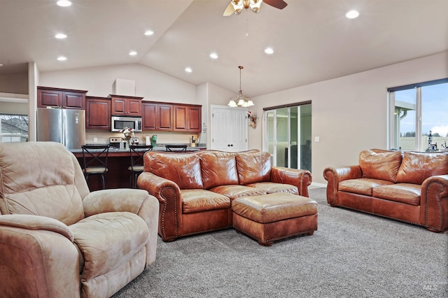 living room with high vaulted ceiling, carpet, recessed lighting, and ceiling fan with notable chandelier