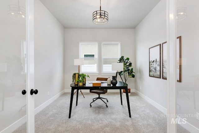 carpeted office space with french doors and baseboards