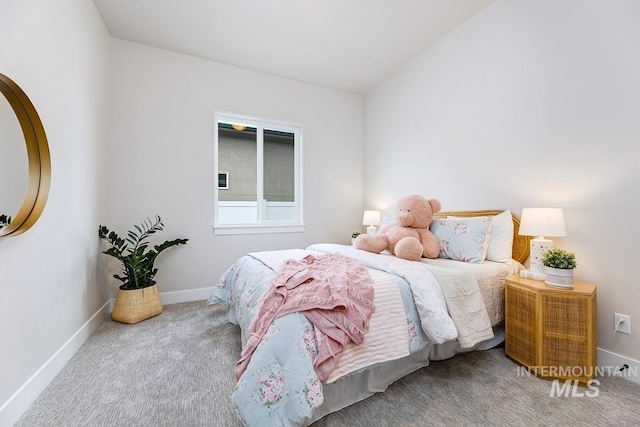 carpeted bedroom with baseboards