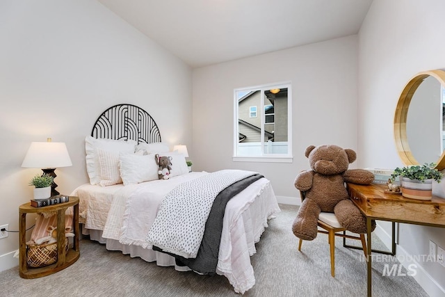 bedroom featuring baseboards and carpet floors