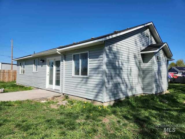 223 N 25th St, Nampa, ID 83687 - view of home's exterior featuring a yard and fence