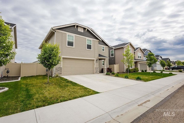 7666 E Lightfoot St, Nampa, ID 83687 - craftsman-style house featuring an attached garage, stone siding, concrete driveway, and a residential view