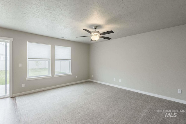 7666 E Lightfoot St, Nampa, ID 83687 - spare room with baseboards, a ceiling fan, carpet flooring, and a textured ceiling