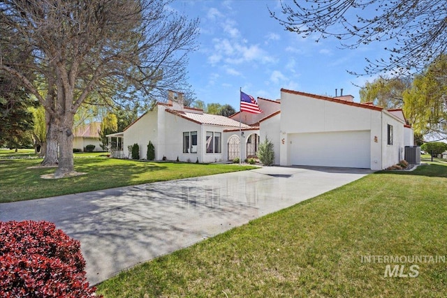 mediterranean / spanish house featuring a front lawn, central air condition unit, stucco siding, driveway, and a garage