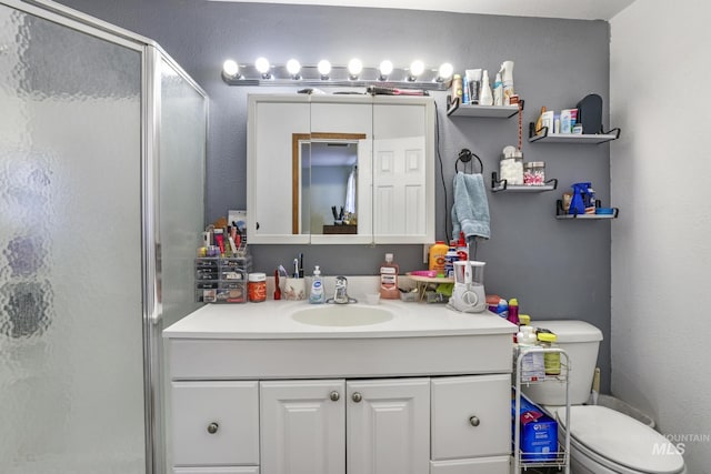 706 Utah St, Gooding, ID 83330 - bathroom featuring a stall shower, vanity, and toilet