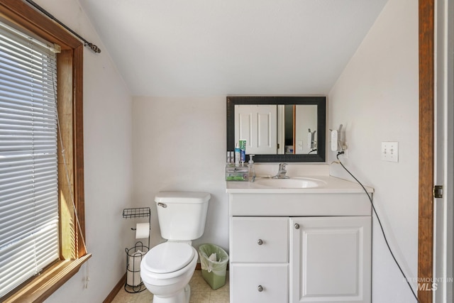 706 Utah St, Gooding, ID 83330 - bathroom featuring toilet, vanity, and baseboards
