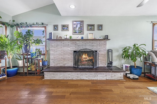 706 Utah St, Gooding, ID 83330 - living room with wood finished floors, a fireplace, and vaulted ceiling