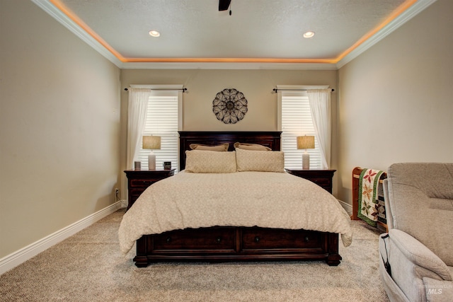 bedroom with crown molding, light colored carpet, and ceiling fan