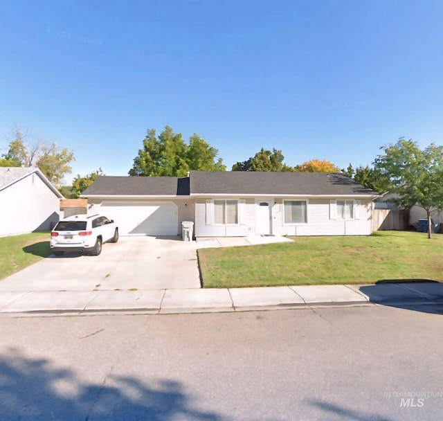 ranch-style house with a front yard and a garage