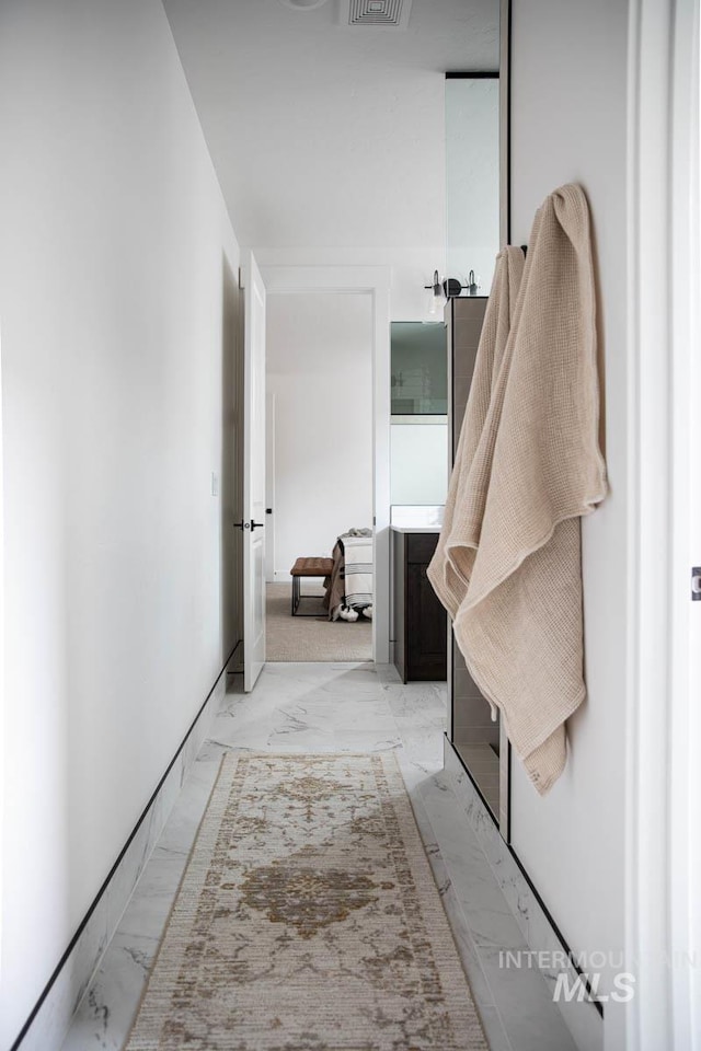 interior space featuring marble finish floor and visible vents