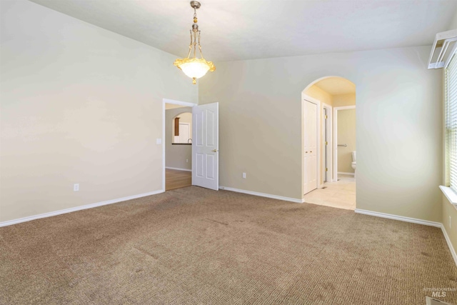 421 N David Frost St, Nampa, ID 83651 - spare room featuring arched walkways, light carpet, baseboards, and plenty of natural light