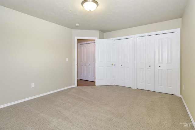 421 N David Frost St, Nampa, ID 83651 - unfurnished bedroom with carpet flooring, two closets, and baseboards