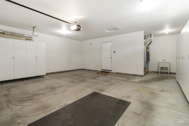 421 N David Frost St, Nampa, ID 83651 - garage with a garage door opener and baseboards