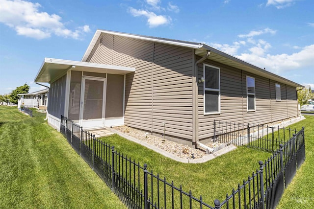 421 N David Frost St, Nampa, ID 83651 - view of side of home with a sunroom