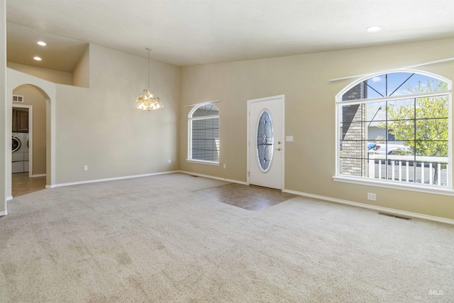 421 N David Frost St, Nampa, ID 83651 - carpeted foyer entrance featuring a chandelier, arched walkways, baseboards, washer / clothes dryer, and recessed lighting