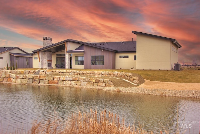 473 Joy Ave, Middleton, ID 83644 - exterior space with central AC unit, a chimney, and a water view