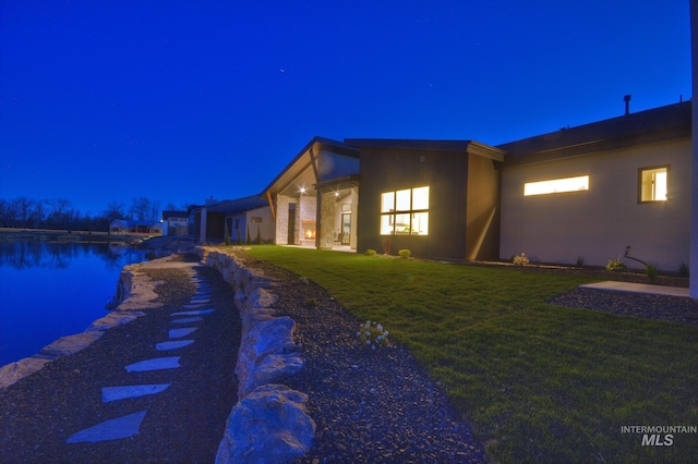 473 Joy Ave, Middleton, ID 83644 - property exterior at twilight featuring an attached garage and a lawn