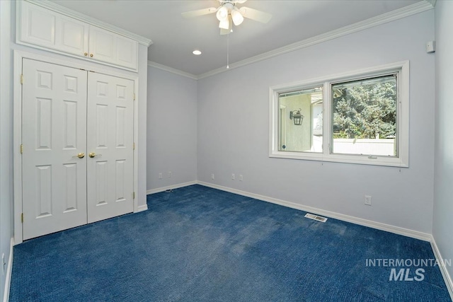 2368 SE 5th Way, Meridian, ID 83642 - unfurnished bedroom featuring dark colored carpet, crown molding, ceiling fan, a closet, and recessed lighting