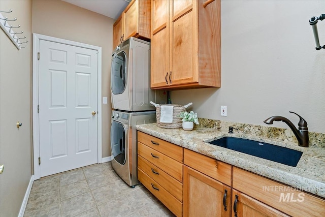 2368 SE 5th Way, Meridian, ID 83642 - laundry area with stacked washer / dryer, cabinet space, and light tile patterned flooring