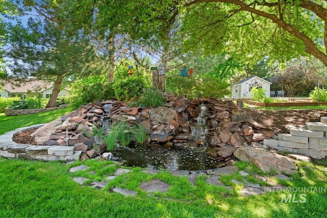 2368 SE 5th Way, Meridian, ID 83642 - view of yard featuring a small pond and an outbuilding