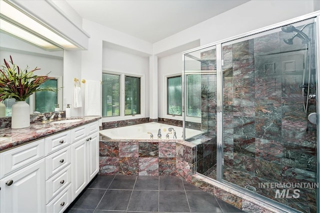 2368 SE 5th Way, Meridian, ID 83642 - bathroom with vanity, a bath, a shower stall, and tile patterned floors